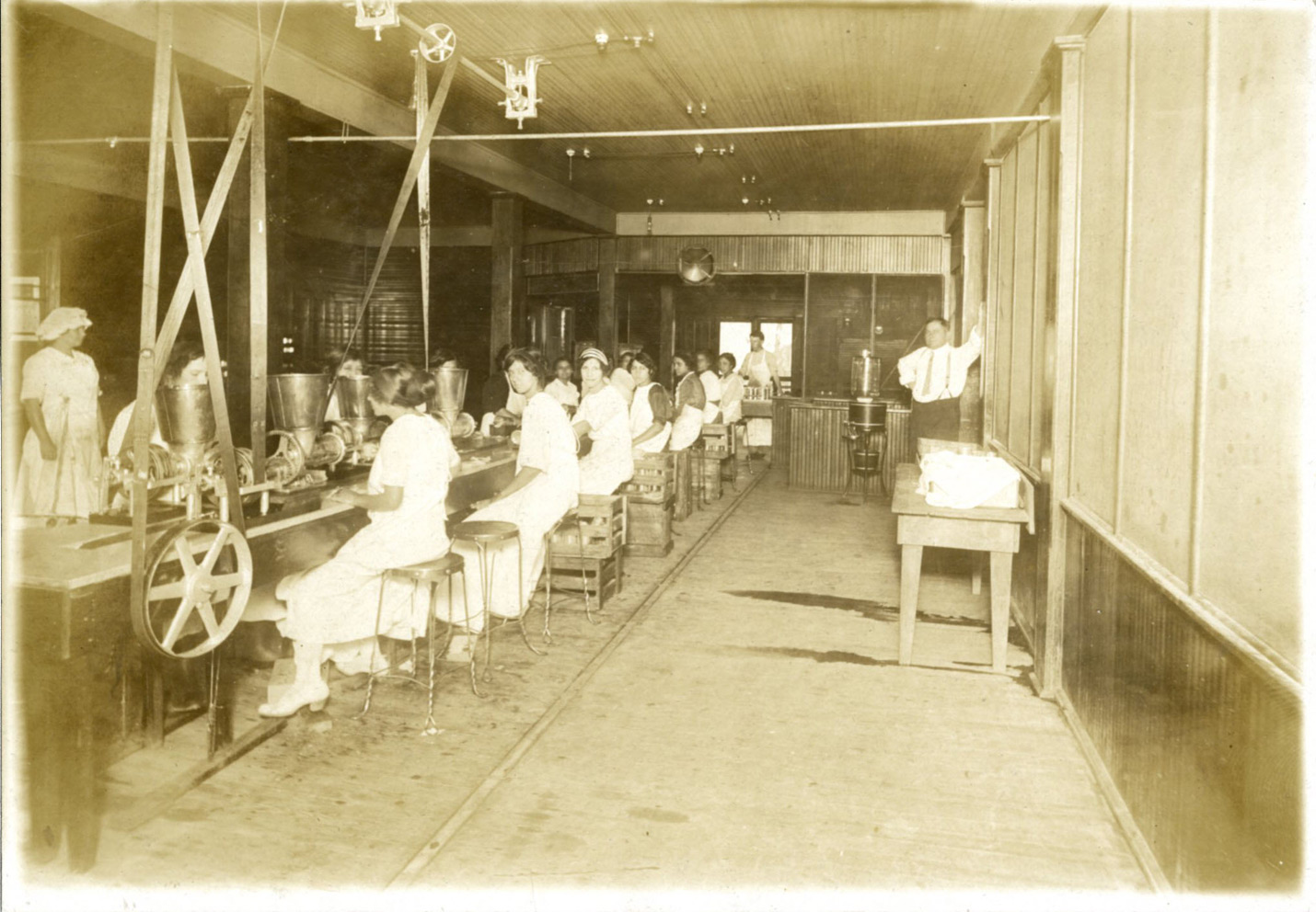 Females working on the chili powder packaging assembly line.